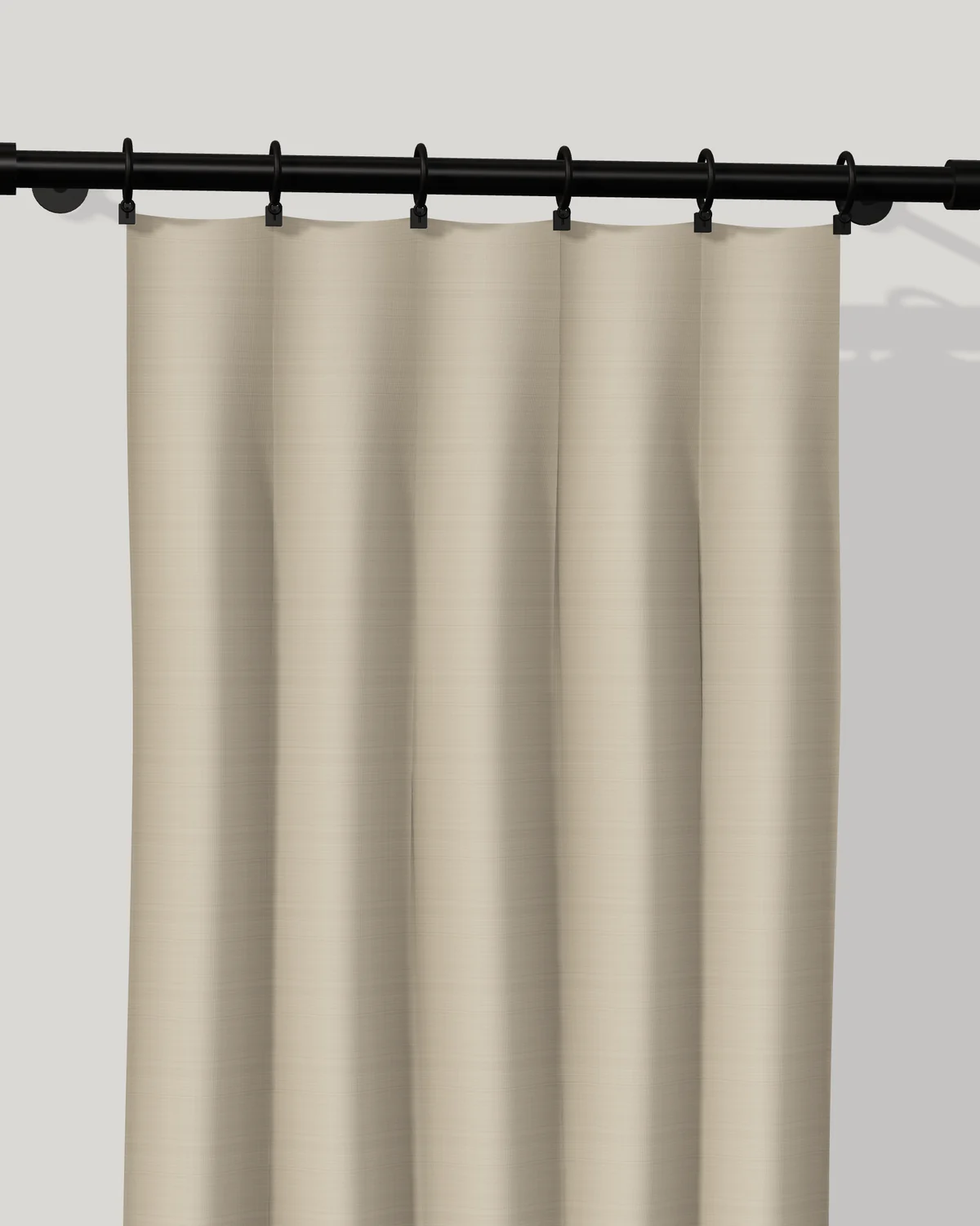 Linen flat-panel drapery with no pleats, clipped to rings on a black rod.