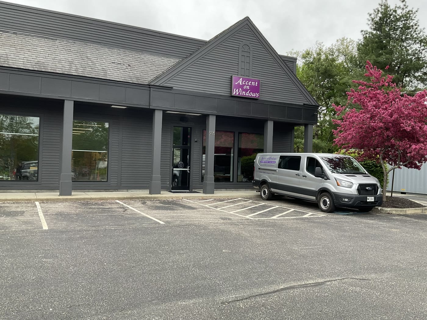 The Accent on Windows showroom at 936 Brighton Avenue in Portland, Maine, with its purple sign and parking out front