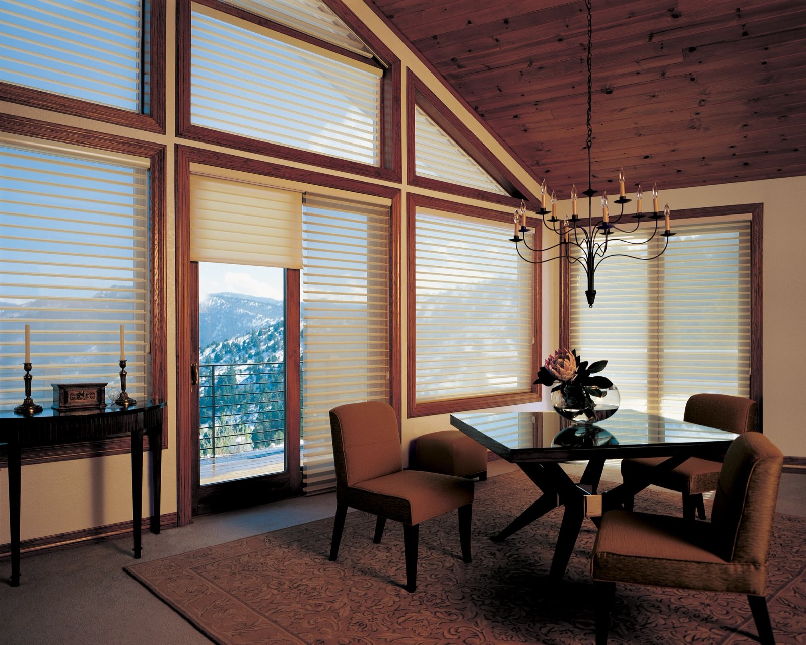 Trapezoid and gable windows under a vaulted ceiling fitted with sheer shadings