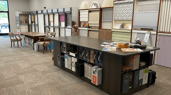 Accent on Windows showroom featuring dozens of window treatment displays and fabric books in Portland, Maine